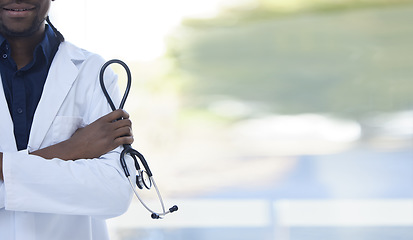 Image showing Doctor, man and hands with stethoscope for healthcare insurance, cardiology or checkup against a blurred background. Hand of male medical professional arms crossed in confidence for health at clinic