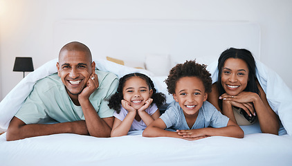 Image showing Portrait, family and smile in bedroom blanket in home, bonding and relaxing or lying. Bed, happiness and children with mother and father enjoying quality time together, having fun and care in house.