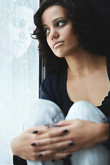 Image showing Depression, rain and thinking with woman by window for sad, tired and lonely. Anxiety, mental health and exhausted with female contemplating at home for broken heart, disappointed and fear mockup