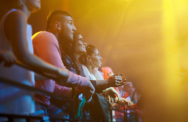 Image showing Audience, fans watching concert and music festival with lights, mockup and crowd at fence at rock event on stage. Excited people at live band performance in arena, men and women with focus on show.