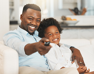 Image showing Black family, sofa and father with boy with tv remote for channel, streaming movies and watching film. Love, home and happy dad with child with television control for entertainment, cartoon and relax