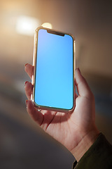 Image showing Closeup, hands or smartphone green screen for woman on social media app, night research or internet mockup branding. Blue, mock up or technology for working late person on business product placement