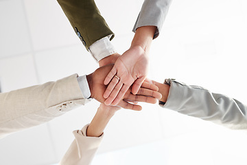 Image showing Business people, hands together and support with team solidarity low angle and motivation in office. Success, collaboration and corporate group with teamwork, professional community and workforce