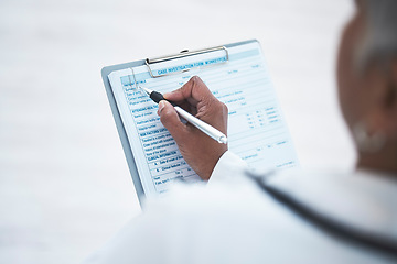 Image showing Doctor, hand and clipboard for writing report in clinic with inspection, healthcare paperwork or info. Woman medic, paper and documents for identity, results or diagnosis with focus at hospital job