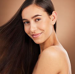 Image showing Hair, salon and portrait of woman in studio for wellness, hairstyle treatment and health on brown background. Hairdresser aesthetic, smile and face of girl with cosmetics, keratin and natural beauty