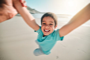 Image showing Portrait, child and sea fun swing in the air with happiness and parent on summer holiday. Happy, smile and vacation of a kid with youth and swinging on the beach outdoor playing by the ocean