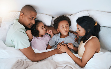 Image showing Family, sleeping and relax in bed above for free time, weekend or holiday morning at home. Top view of tired or exhausted mother, father and children or kids relaxing or asleep together in bedroom