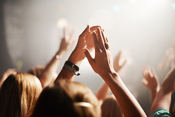 Image showing Clapping crowd, party and people at a concert for celebration, performance and watching a band. Energy, audience support and fans applause at a music festival, club or dancing rave show at night