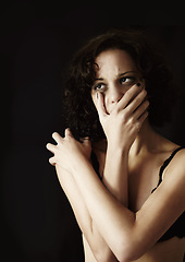 Image showing Depression, anorexia and alone with a woman on a dark background in studio suffering from an eating disorder. Mental health, bulimia and stress with an unhealthy young female person feeling anxiety