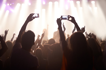 Image showing Music, festival and hands of audience with phone for pictures, celebration and enjoying night, concert or event. Party, people and performance with excited fans showing support, passion and recording