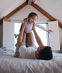Image showing Airplane, game and child with father on a bed happy, playing and bonding in the morning together. Flying, fun and excited girl with parent in a bedroom for creative, fantasy and childhood happiness