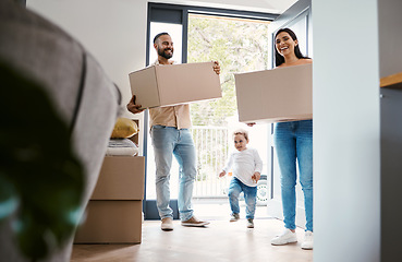 Image showing Moving family, new house and carrying boxes in real estate property as happy people, child and homeowner. Move, parents walking in front door and excited with love, mortgage and apartment relocation