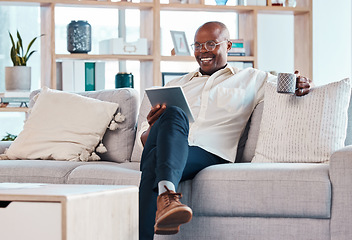 Image showing Tablet, coffee break and relax with a black man on the sofa, sitting in the living room of his home or office. Business, tech or research with a male employee reading an online article while chilling