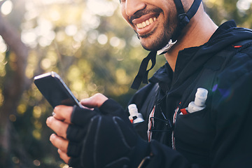 Image showing Sports, man and phone outdoor for cycling, mountain biking or workout and smile in nature. Male person in forest with smartphone in hands for communication, gps travel app or fitness with safety gear