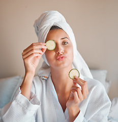 Image showing Eye mask, happy and portrait of a woman with cucumber for wellness, face care and skincare at home. Playful, home spa and a girl with food for facial hydration, nutrition and weekend relaxation