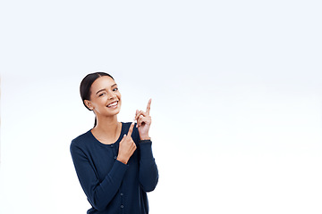 Image showing Studio mock up, portrait or happy woman pointing at sales promotion, advertising copy space or discount deal mockup. Brand commercial, marketing or presentation gesture for female on white background