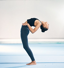 Image showing Stretching, gymnastics and fitness with woman in gym for flexibility, training and competition. Workout, exercises and championships practice with female and warm up for sports, wellness and dance