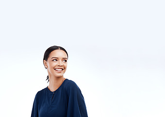 Image showing Woman, smile and studio with a happy modern female looking at mockup for advertisement space. Happiness, joy and gen z female relax with youth and smiling with isolated white background and mock up