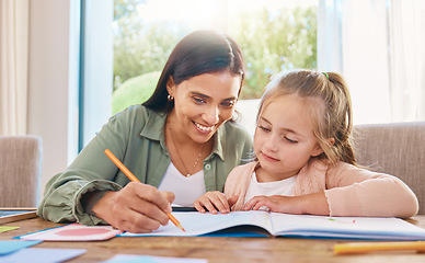 Image showing Writing, helping and happy mother with girl for home education, language support and creative development. Family, biracial mom or woman teaching child, learning and drawing in book for creativity