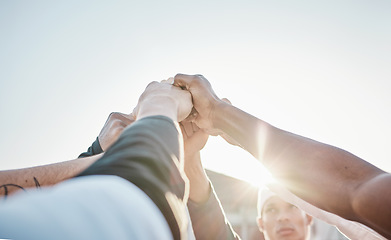 Image showing Hands up, motivation or sports men in huddle with support, hope or faith on baseball field in game together. Teamwork, fist or group of young softball athletes with goals, mission or solidarity