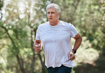 Image showing Senior man, exercise and outdoor with music earphones for run, workout and training for fitness. Elderly male focus on cardio health, audio and wellness while running in in nature and retirement