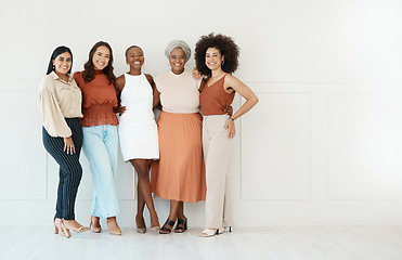 Image showing Portrait, teamwork and business women smile in office standing together by white wall mockup. Happiness, diversity and group of friends, employees or staff with cooperation or workplace collaboration