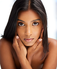 Image showing .Portrait, beauty and skincare with an indian woman in her home, feeling beautiful or fresh. Face, hair and relax with an attractive young female in her apartment looking confident or feminine.