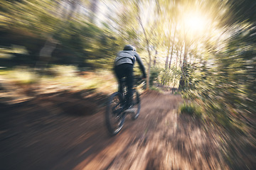 Image showing Energy, cycling, and speed with man in nature for training, extreme sports and motion blur. Workout, race and fast with cyclist on bike in forest park for performance, challenge and adventure