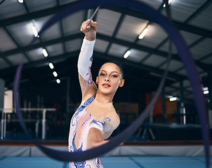 Image showing Ribbon, gymnastics and portrait of woman in action, dance performance and sports competition. Female, rhythmic movement and dancing athlete with creative talent, concert event and practice arena