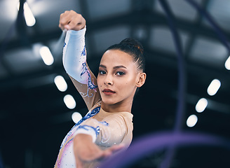 Image showing Portrait of woman, ribbon gymnastics and dance for performance, sports competition and action show. Female, rhythmic movement and dancing athlete with creative talent, concert event and agility skill