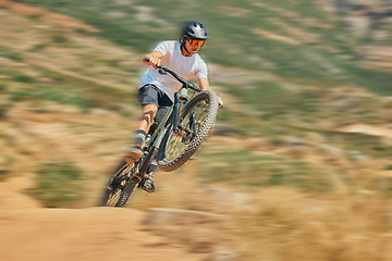 Image showing Cycling, jumping and extreme sports with man on mountain bike for adventure, fitness and adrenaline junkie. Exercise, risk and fast with male athlete in nature for workout, training and speed