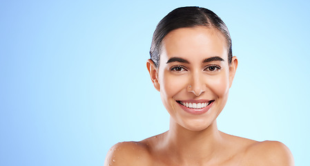 Image showing Banner, skincare portrait or happy woman in studio with youth, beauty or young face on blue background. Dermatology mockup space, wellness or beautiful girl with facial treatments or glowing results