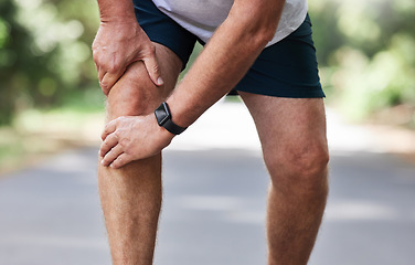 Image showing Running, knee pain and old man with hand on leg in park in for outdoor fitness and workout exercise. Health, wellness and muscle strain, senior runner with injury, hands on ache in support or relief.