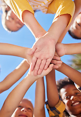 Image showing Below hands stack, children together and outdoor for sunshine, teamwork and learning in summer. Happy kids group, low angle and support with solidarity, diversity and playful in nature for excursion