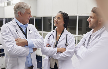 Image showing Discussion, healthcare and team of doctors in the hospital talking in hallway after consultation. Collaboration, teamwork and group of professional medical workers in conversation in medicare clinic.