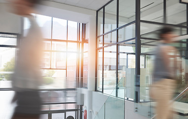 Image showing Busy office, business people and walking with motion blur or fast speed in company. Employees, coworking and workers rush with movement in workplace, lobby or hallway for workspace productivity.