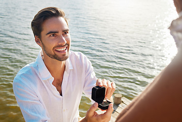 Image showing Engagement, proposal and man by lake with ring for romantic holiday, vacation and honeymoon in nature. Love, commitment and happy couple outdoors with diamond, jewellery and gift box for marriage