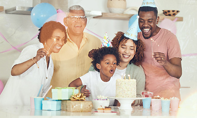 Image showing Birthday, party and cake with family in kitchen for celebration, bonding and affectionate. Happiness, excited and grandparents with parents and child at home for surprise, fun and event