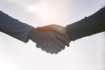 Image showing Handshake, agreement and people partnership, outdoor teamwork and collaboration for onboarding or b2b. Business person, professional partner and shaking hands welcome, thank you or deal in lens flare