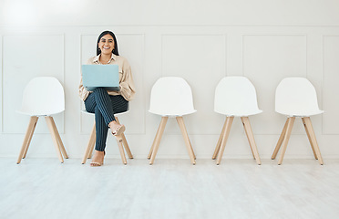 Image showing Portrait, laptop and woman in waiting room, interview or recruitment, hiring or office job. Computer, hr and happy business person or female from India sitting on chair for employment in workplace