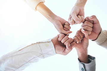 Image showing Below business people, fist bump and circle for team building, support and group goals in workplace. Men, women and teamwork with solidarity for success, motivation and trust with diversity at job