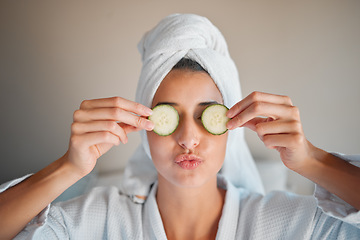 Image showing Self care, skincare and woman with cucumber on her face for a organic, cosmetic and natural skin routine. Beauty, vegetable and female doing a spa facial treatment for self love and to relax at home.