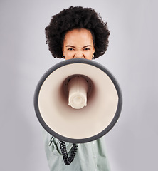 Image showing Megaphone, protest and black woman shouting in portrait in studio isolated on a white background. Screaming, angry and person with loudspeaker protesting for change or justice, announcement or speech