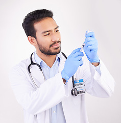 Image showing Healthcare, vaccine and man doctor with injection or shot in studio against a white background. Medicine, vaccination and man health expert with needle for medical, innovation or disease treatment