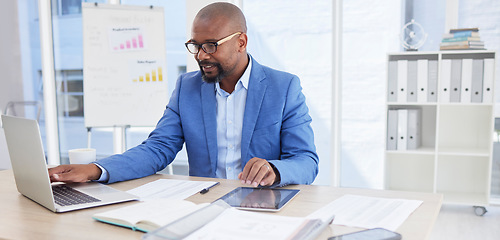 Image showing Black man, business and laptop for corporate planning, strategy or communication at the office desk. African American male CEO working on computer for company statistics, marketing or schedule tasks