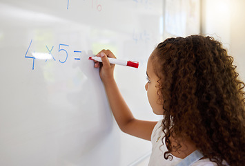 Image showing Whiteboard, math and girl writing for learning, studying and education in classroom. Development, mathematics and kid or student write equations, numbers and multiplication for knowledge in preschool