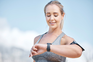 Image showing Fitness, woman and smart watch checking time, tracking performance or monitoring exercise in nature. Happy and fit female runner looking at wristwatch for sport tracker, counter or workout on mockup