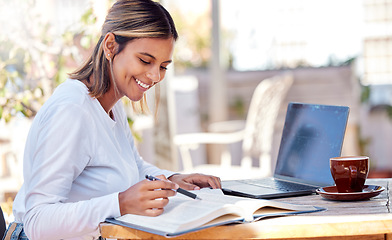 Image showing Woman, reading textbook and student, education with smile and study academic course, learning and university. Happy female at outdoor cafe, book and pen for research and studying for exam with laptop