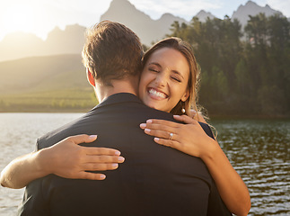 Image showing Wedding, lake and happy couple hugging in nature and water with passion, smile and romance. Marriage, excited bride and groom hug to celebrate romantic relationship, loving man and woman together.