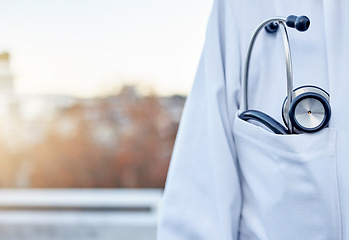 Image showing Doctor, stethoscope and pocket in city for healthcare cardiology on balcony rooftop for surgery on mockup. Closeup of medical professional or expert with listening device for sounds in an urban town